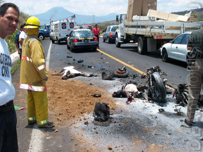 Accident with a motorcyclist. Burnt corpse