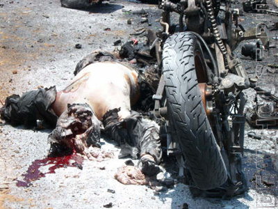 Accident with a motorcyclist. Burnt corpse