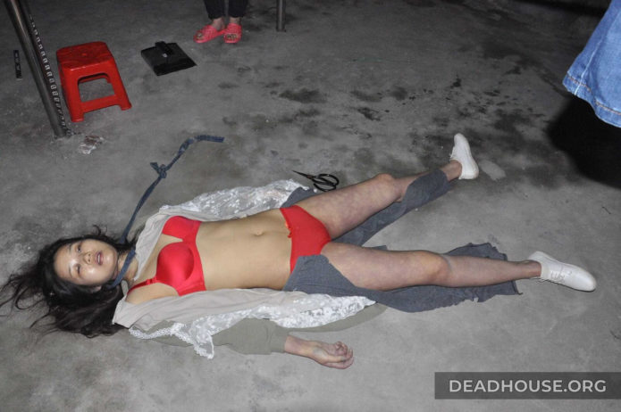 The corpse of a Chinese girl in a red swimsuit