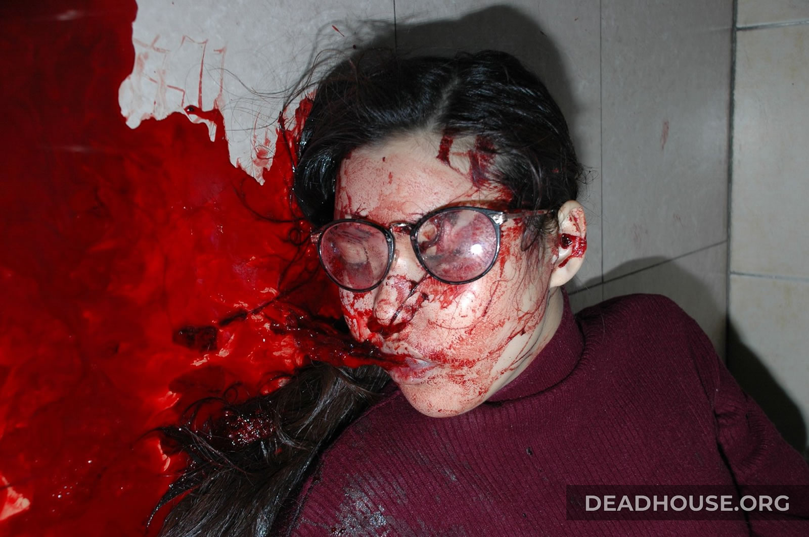 The corpse of a girl covered in blood