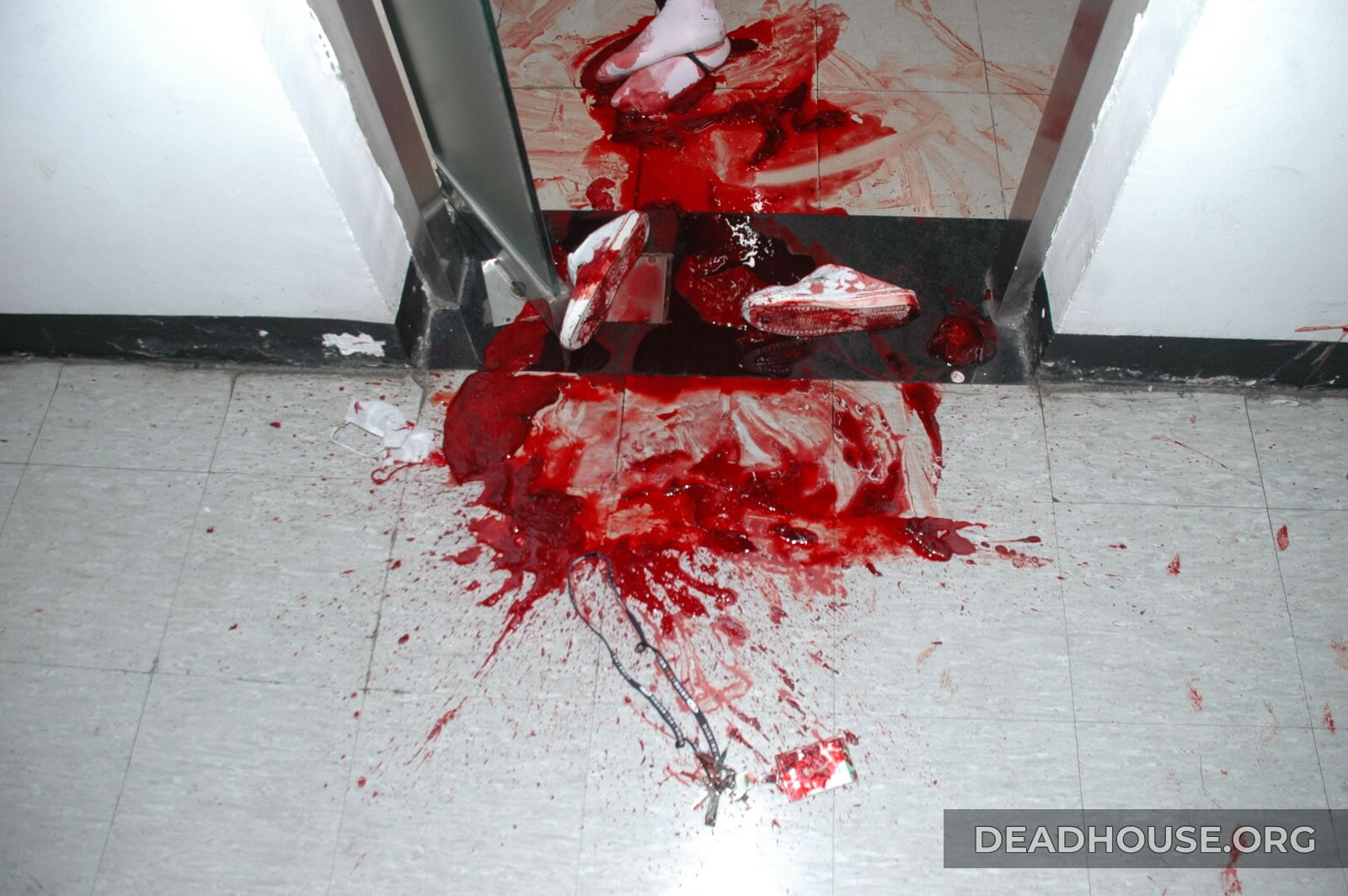 Bloody shoes in the doorway