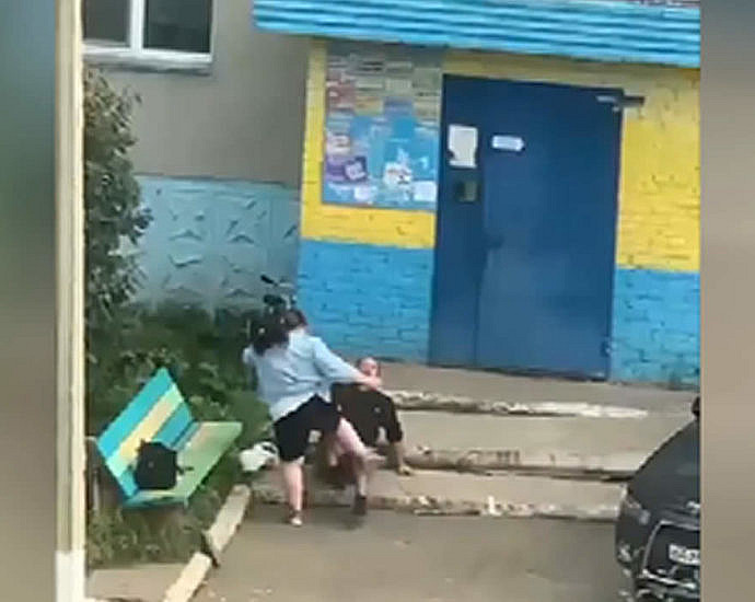 Woman beating a man