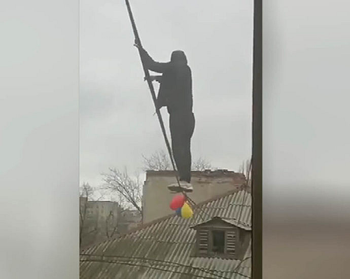 Man climbing wires