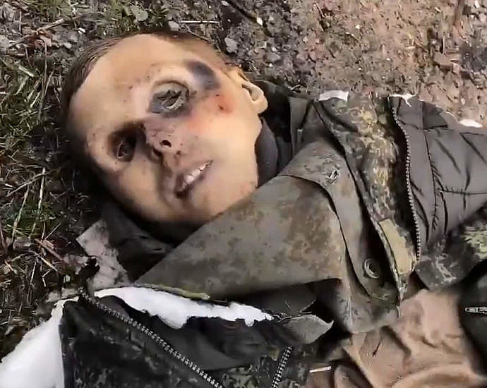 Ukrainian soldiers demonstrate the corpses of the Russian military
