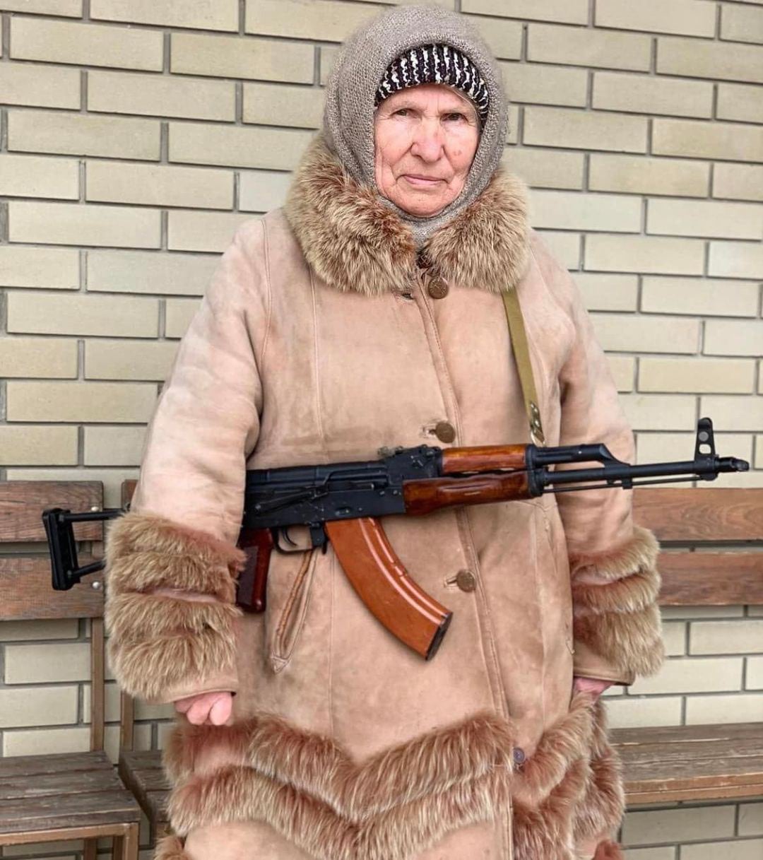 Grandmother with a Kalashnikov assault rifle. Ukraine