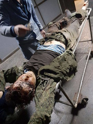 The corpse of a Russian paratrooper on a gurney