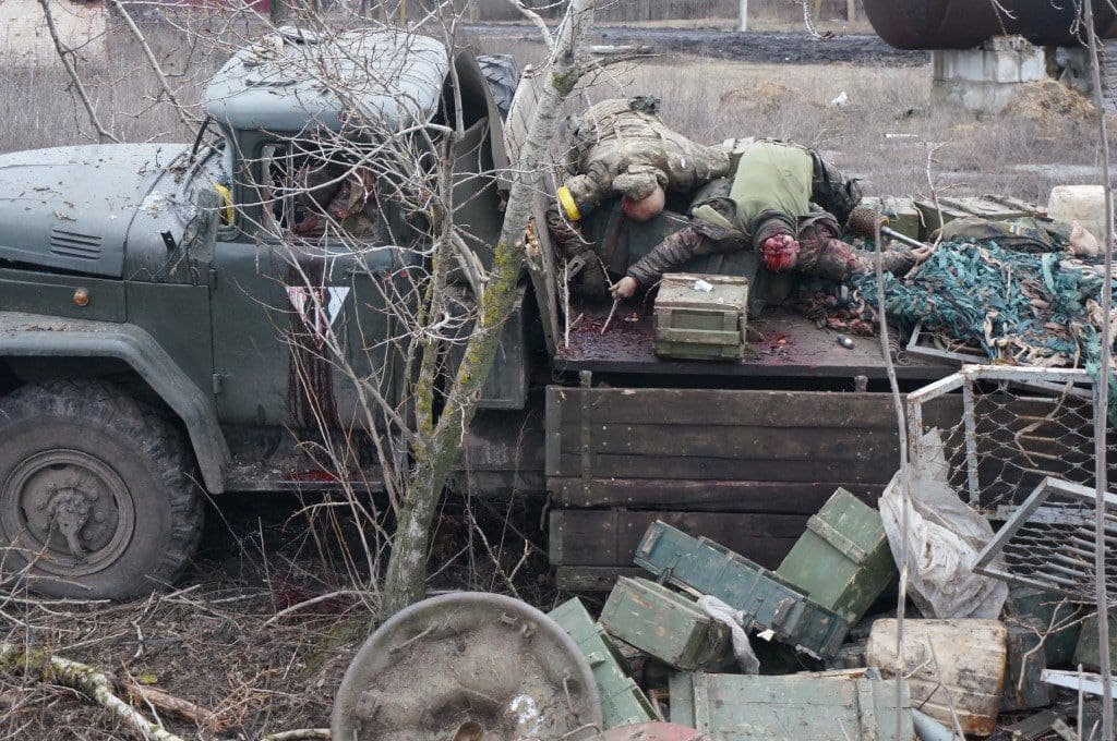 Killed Ukrainian soldiers and a wrecked ammunition truck