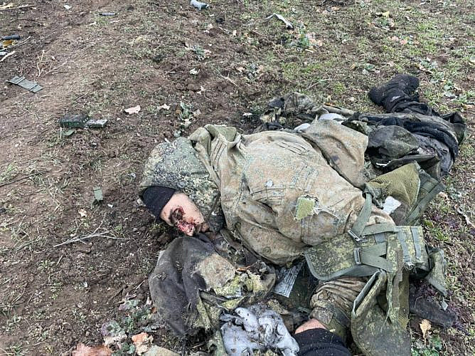 The corpse of a Russian soldier in a hood