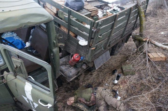 Killed Ukrainian soldier next to the truck