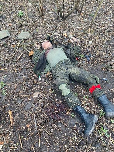 Corpse of a Russian soldier with a red armband