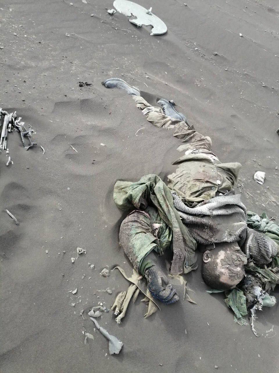 Corpses of Russian soldiers covered with sand