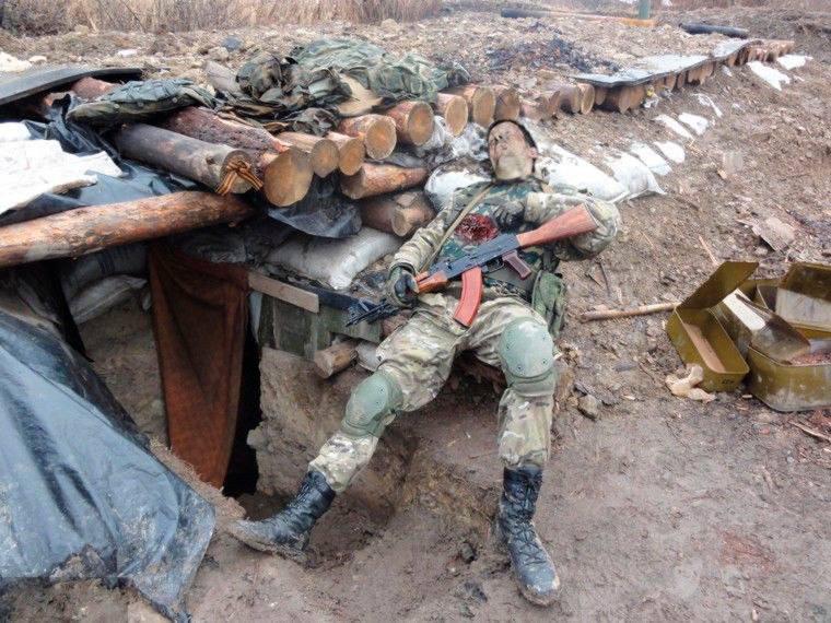 Corpse of a Russian soldier with a Kalashnikov assault rifle