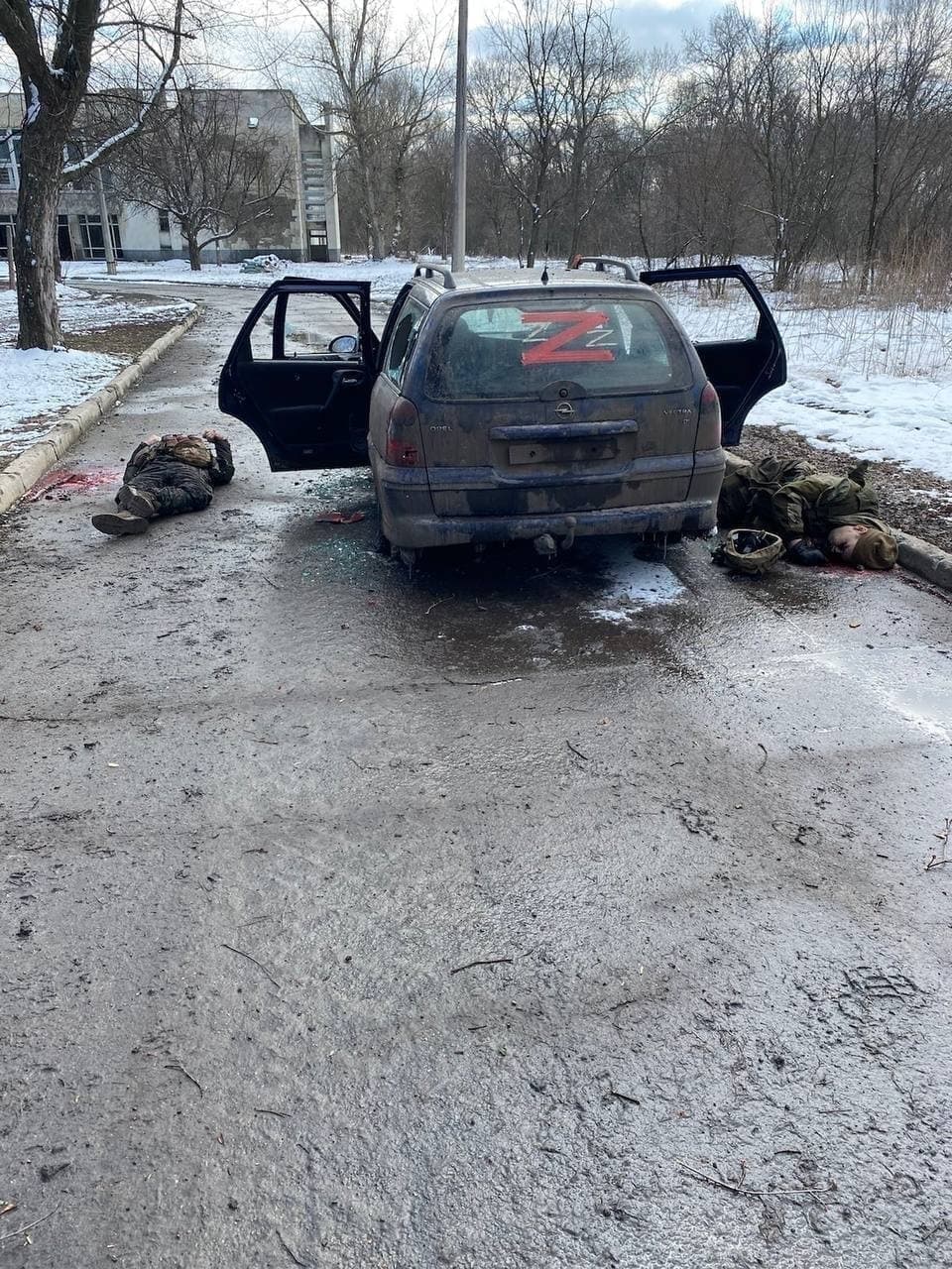 Corpses in military uniform and a Z sign on a car. Lugansk