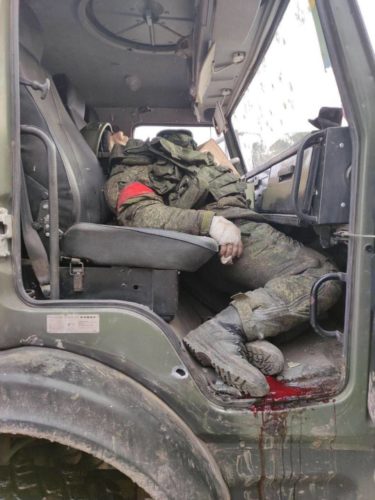 The corpse of a Russian military man in a car