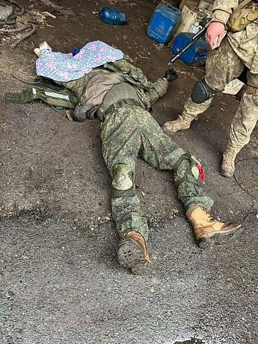 The corpse of a Russian military man with a covered face