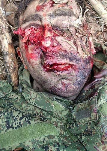 Disfigured face of the corpse of a Russian soldier